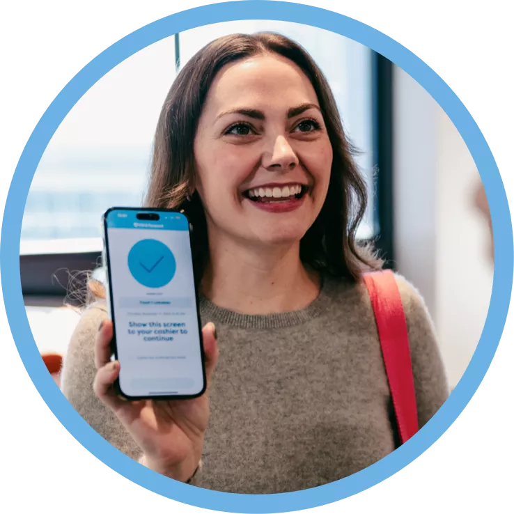 A woman showing her phone. The phone is the Fill it Forward app on showcasing the Borrow feature.